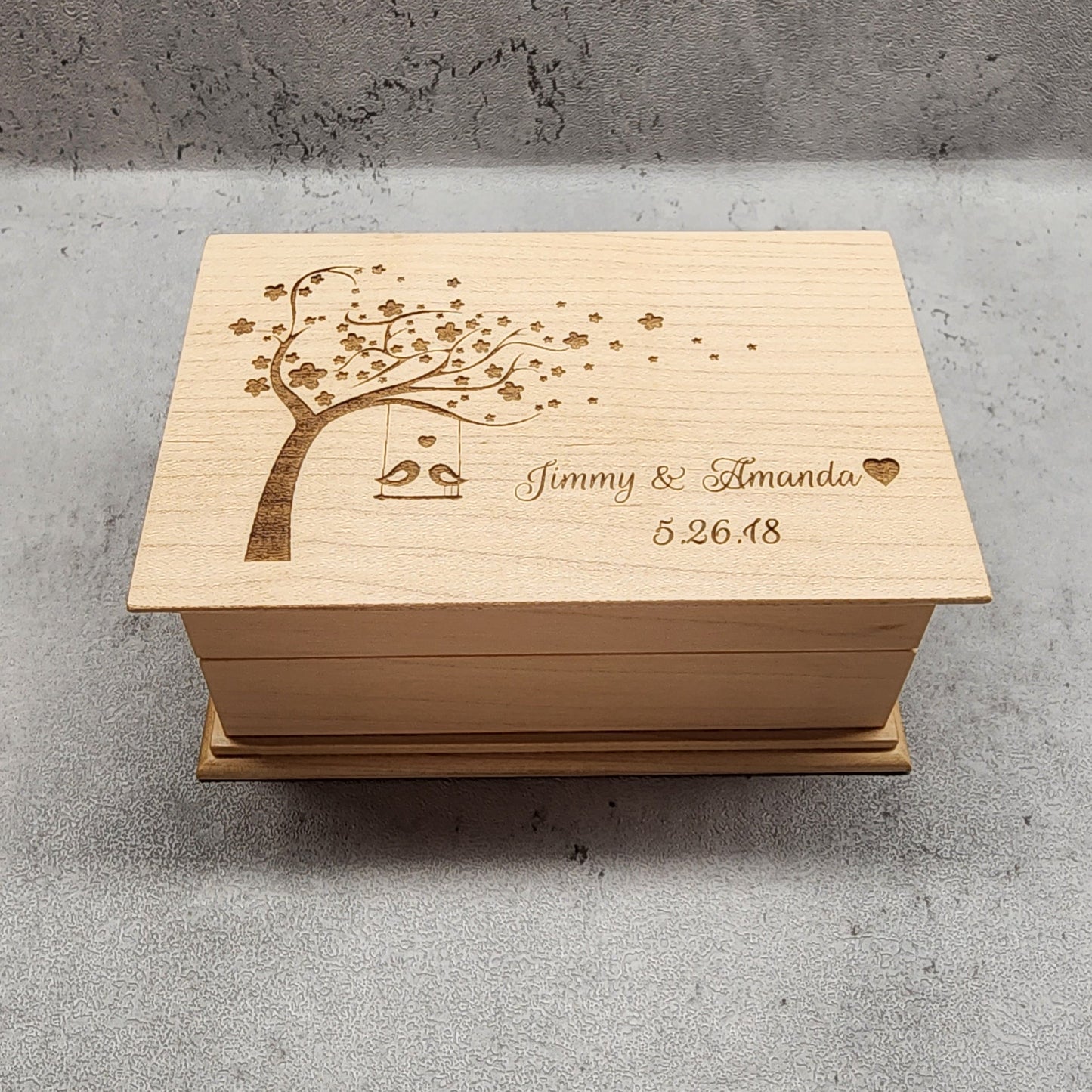Jewelry Box with love birds on tree swing, personalized with your names and date, plays your song choice when opened and it is made with high quality US maple wood, made in the US