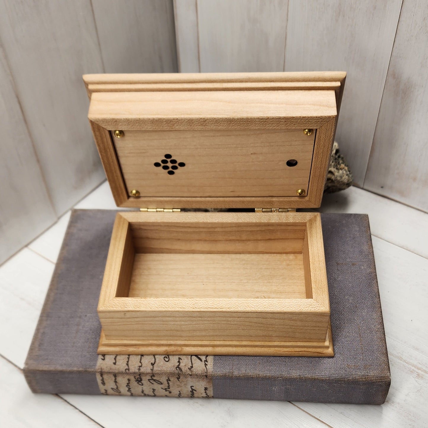 Jewelry Box with customized engraving, color and song choice showing a maple wood box opened.