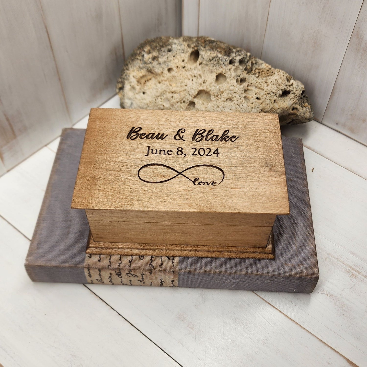 Personalized infinity love music box engraved with names “Beau & Blake,” date “June 8, 2024,” and infinity symbol with word “love.”
