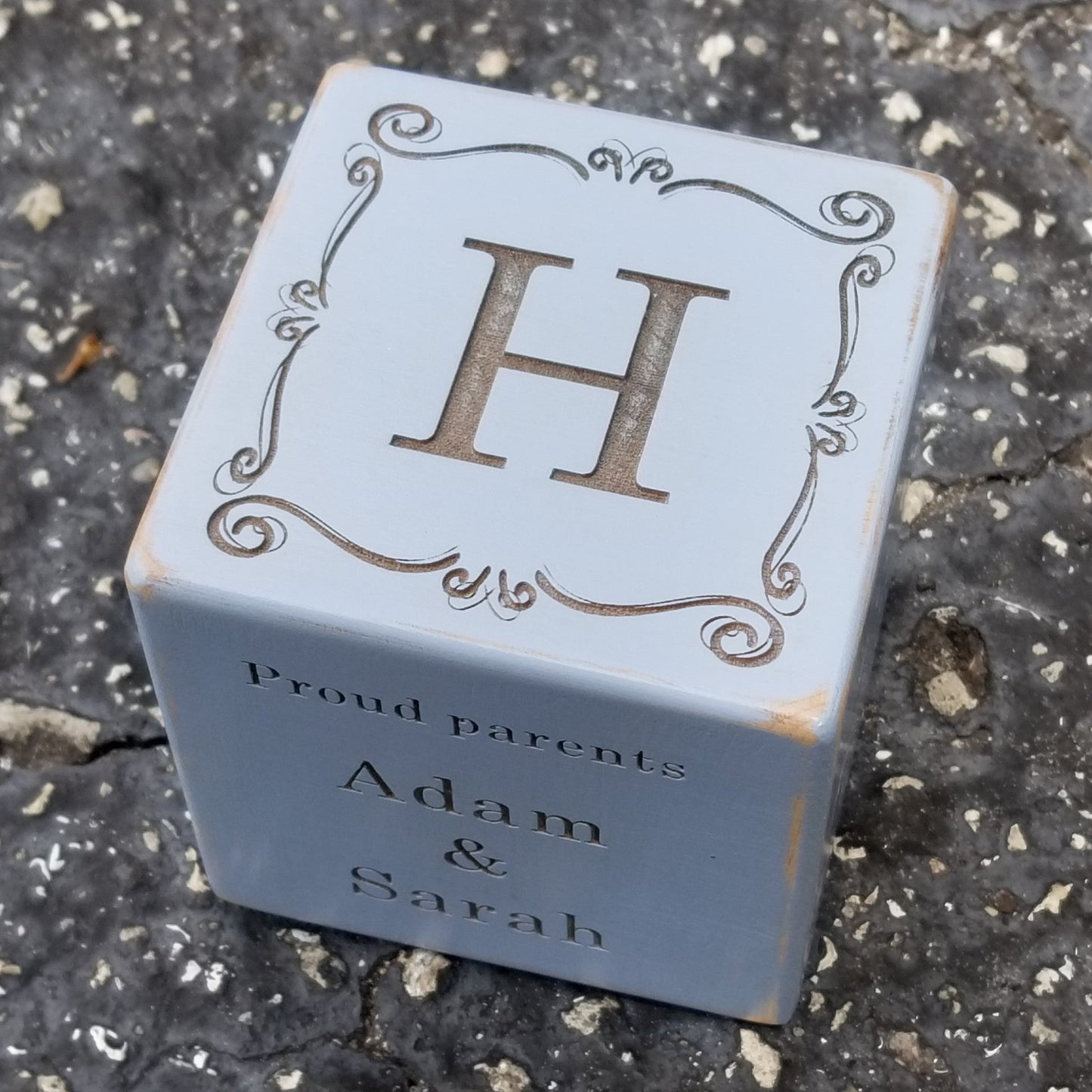 blue baby block engraved with monogram, parents names, baby's birth date