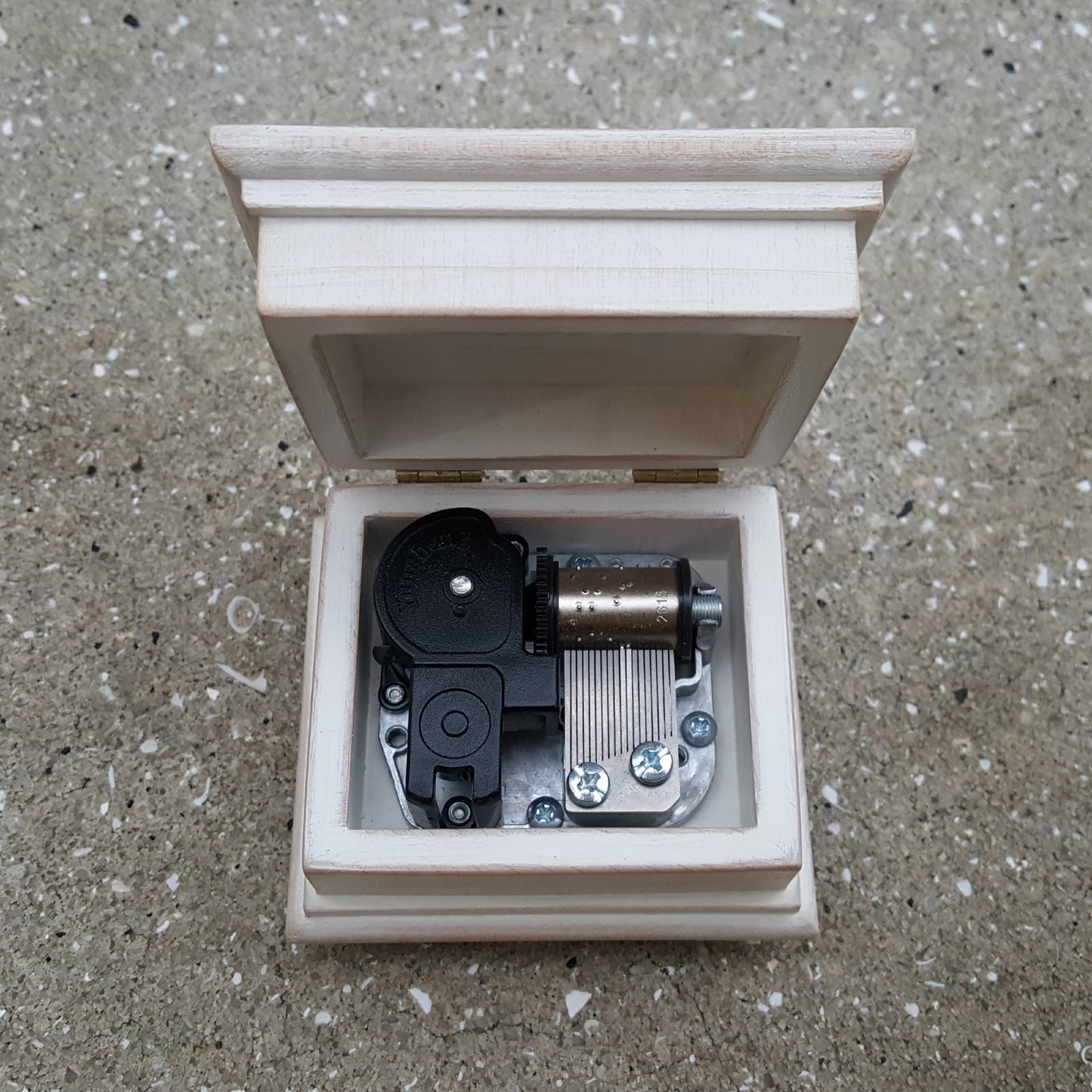 music box with an open lid in white