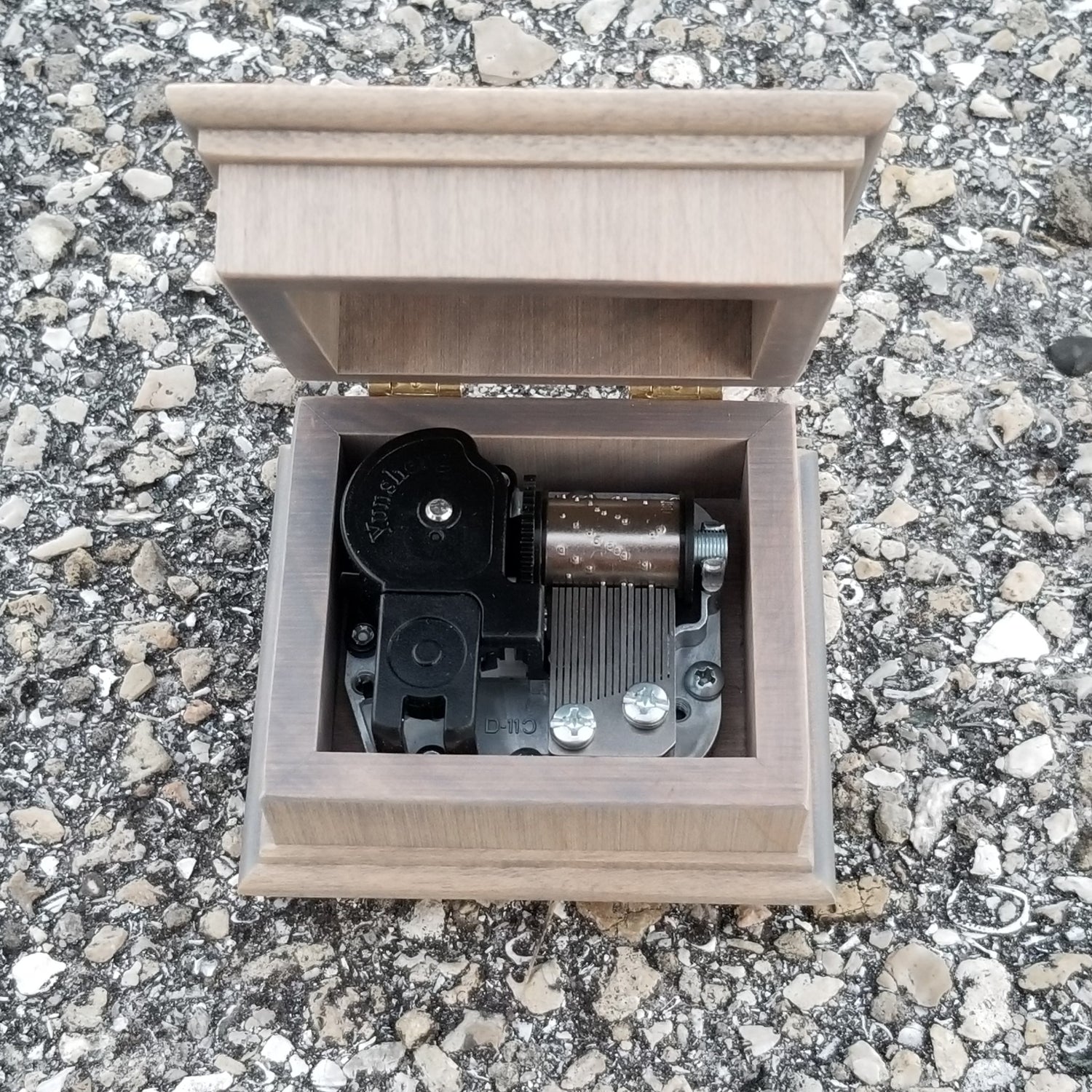 music box open lid with music box movement inside, playing Butterfly Kisses