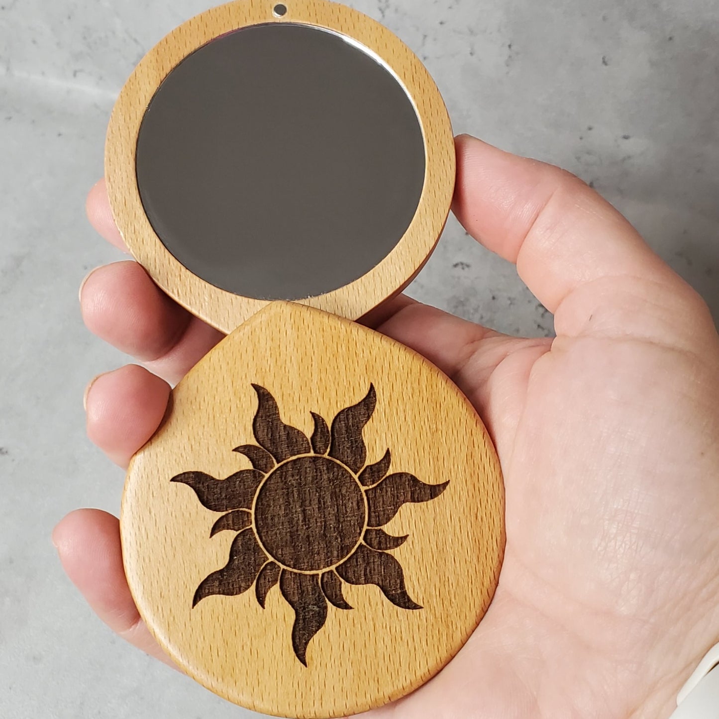 beauty mirror engraved with sun, perfect size to fit into your purse to check your smile