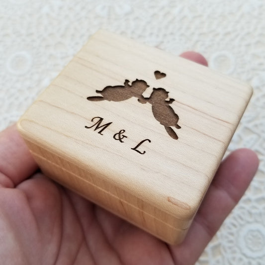 ring box with love otters and initials engraved on top