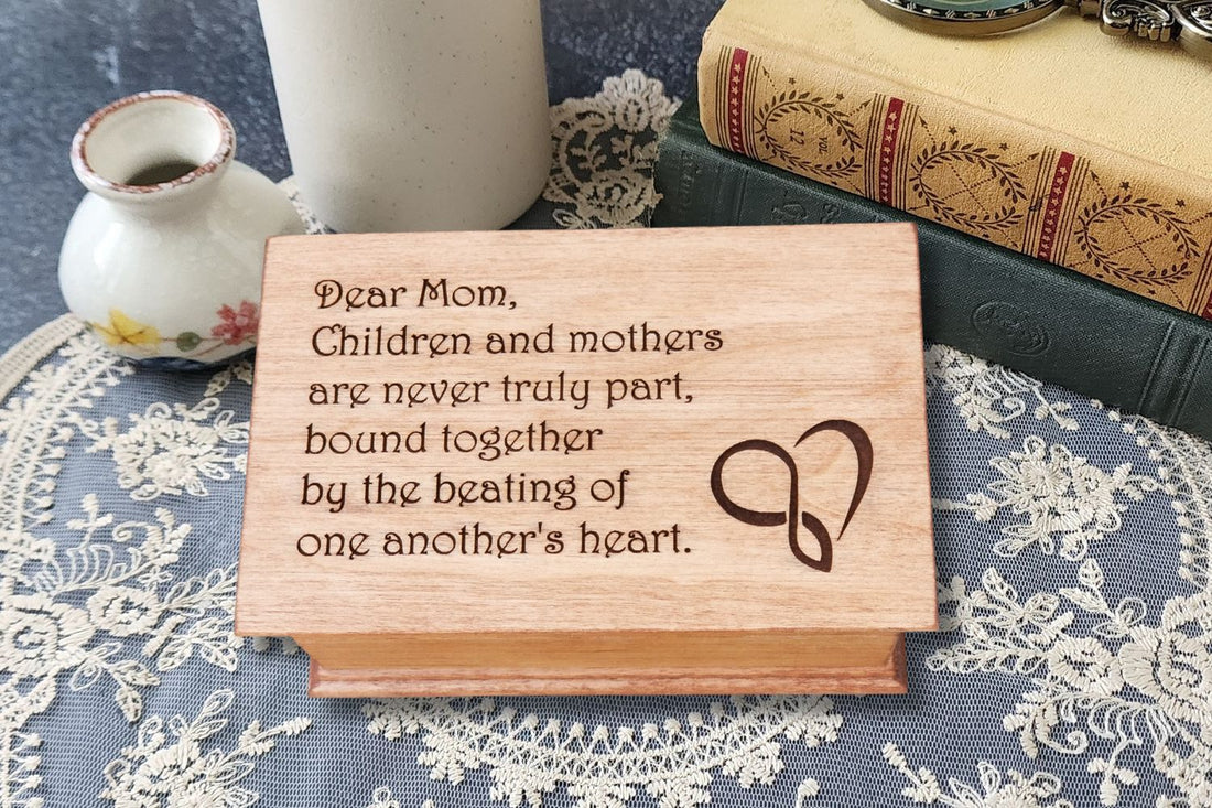 Personalized wooden music box engraved with heartfelt message for Mom, unique handmade Mother’s Day gift for music lovers.