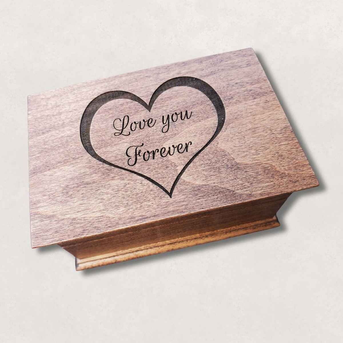 Wooden jewelry box engraved with heart outline and the words Love You Forever on the lid