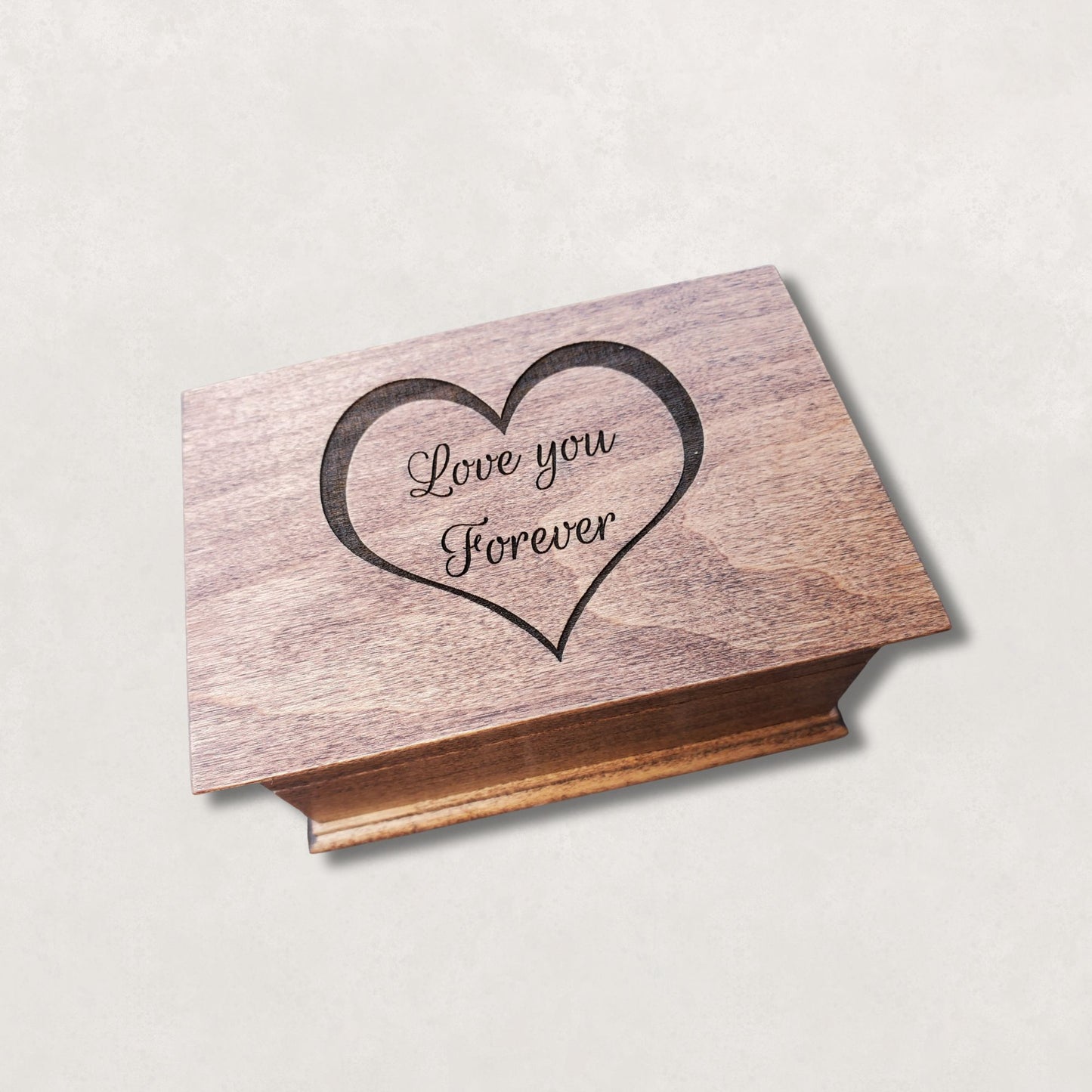 Wooden jewelry box engraved with heart outline and the words Love You Forever on the lid