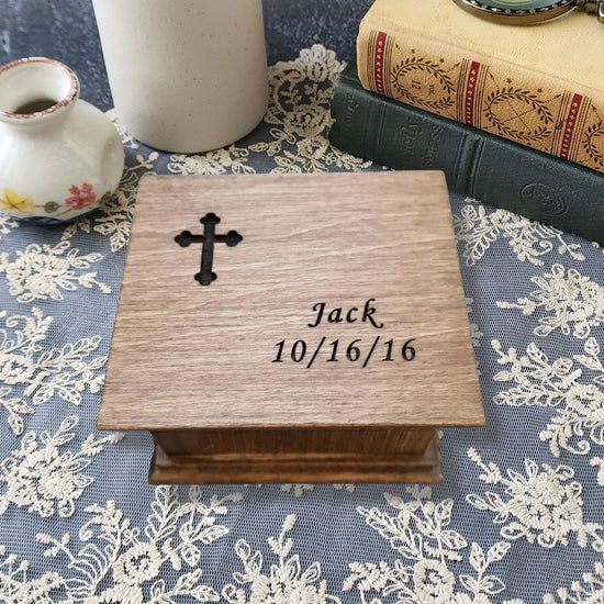 Wooden music box with a cross and name and date engraved on the top. Perfect gift for Baptism