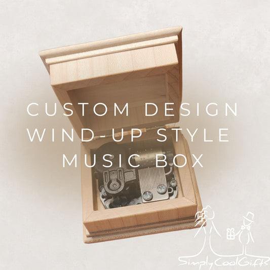 Wooden music box with wind-up mechanism on a light background