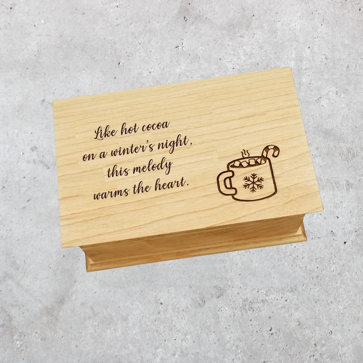 Handmade Christmas music box engraved with hot cocoa mug and holiday quote: " Like hot cocoa on a winter's night, this melody warms the heart. "