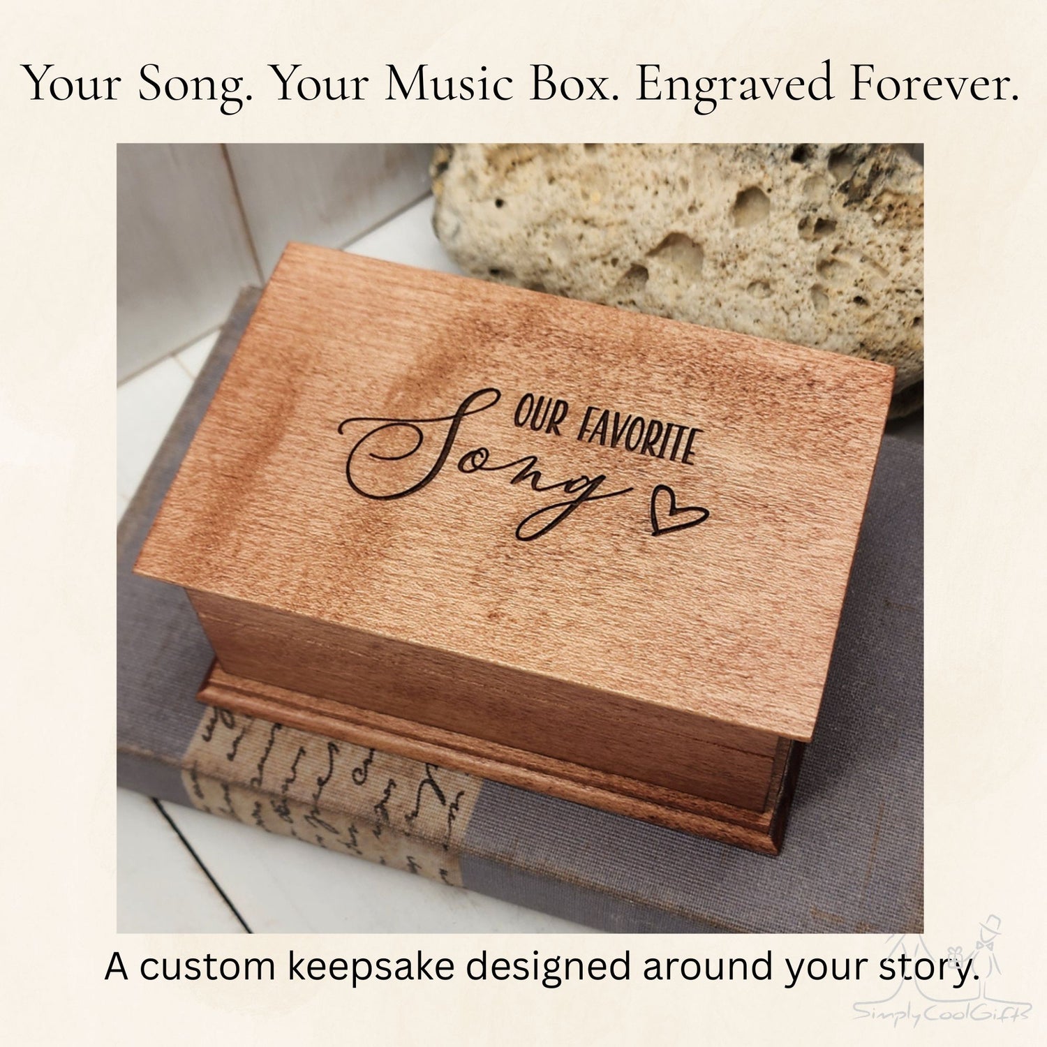Wooden music box with 'Our Favorite Song' engraving on a surface.