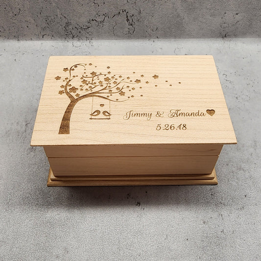 Jewelry Box with love birds on tree swing, personalized with your names and date, plays your song choice when opened and it is made with high quality US maple wood, made in the US