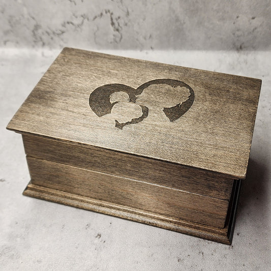 wooden music box in ebony with an engraving of a mom and daughter inside a heart, choose color, add your song choice and add a personalized message to the bottom side of box and mom will cry tears of joy