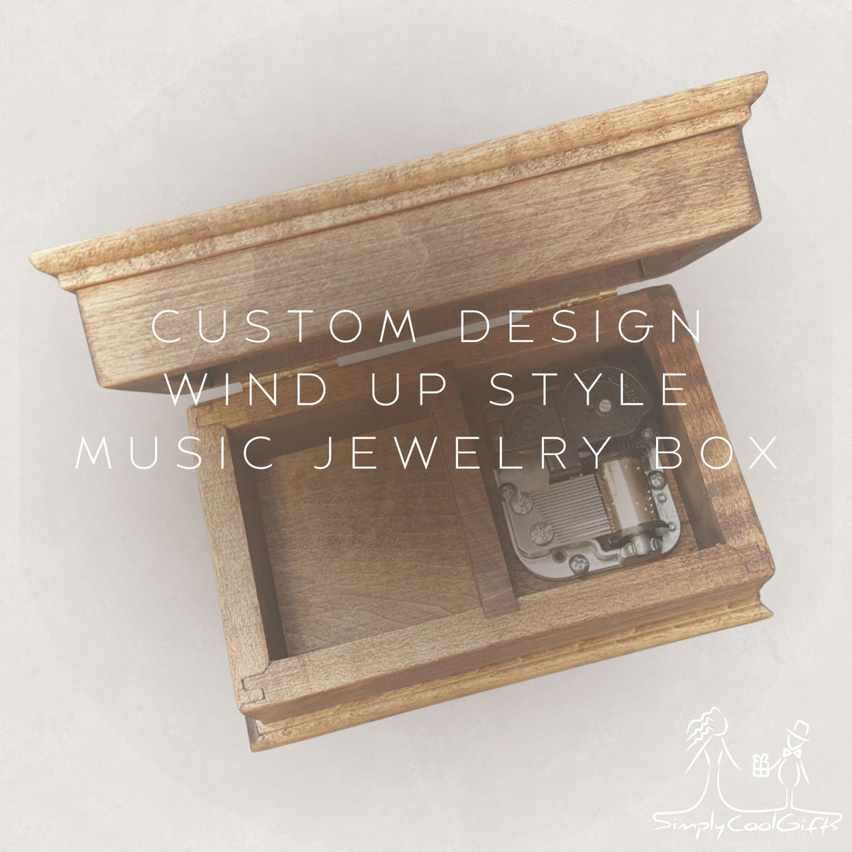 Wooden music jewelry box with wind-up mechanism on a light gray background