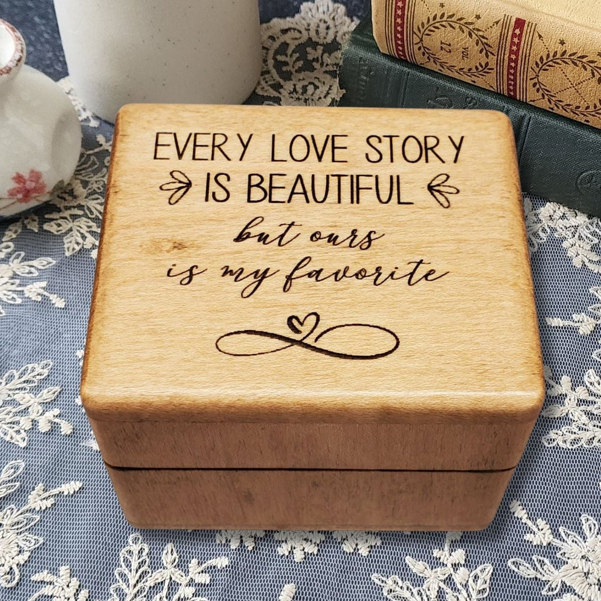 Wooden music ring box engraved with the quote “Every love story is beautiful but ours is my favorite,” perfect handmade romantic gift for weddings, anniversaries, or Valentine’s Day.