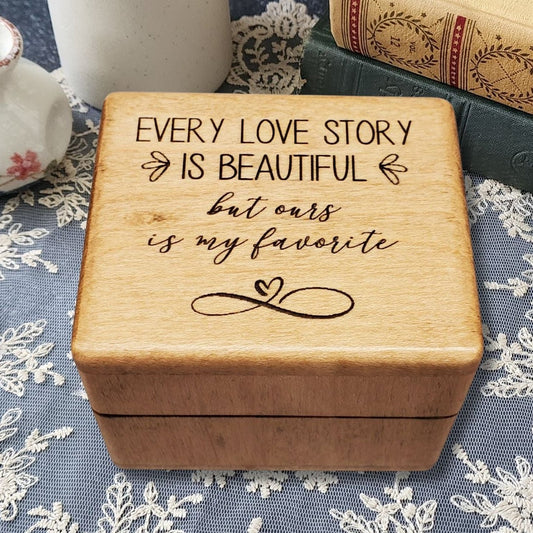 Wooden music ring box engraved with the quote “Every love story is beautiful but ours is my favorite,” perfect handmade romantic gift for weddings, anniversaries, or Valentine’s Day.