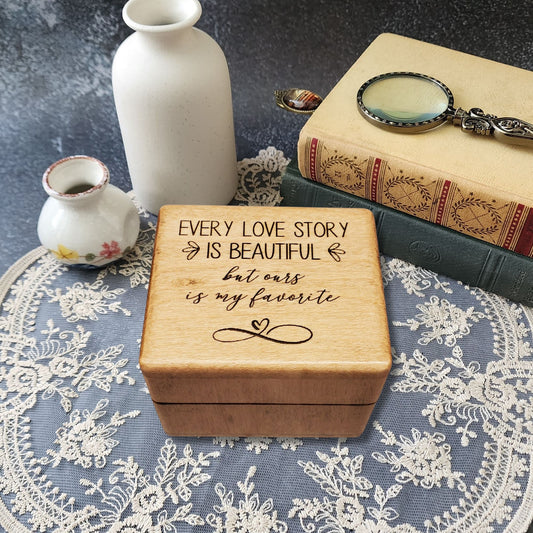 Wooden music ring box engraved with the quote “Every love story is beautiful but ours is my favorite,” perfect handmade romantic gift for weddings, anniversaries, or Valentine’s Day.
