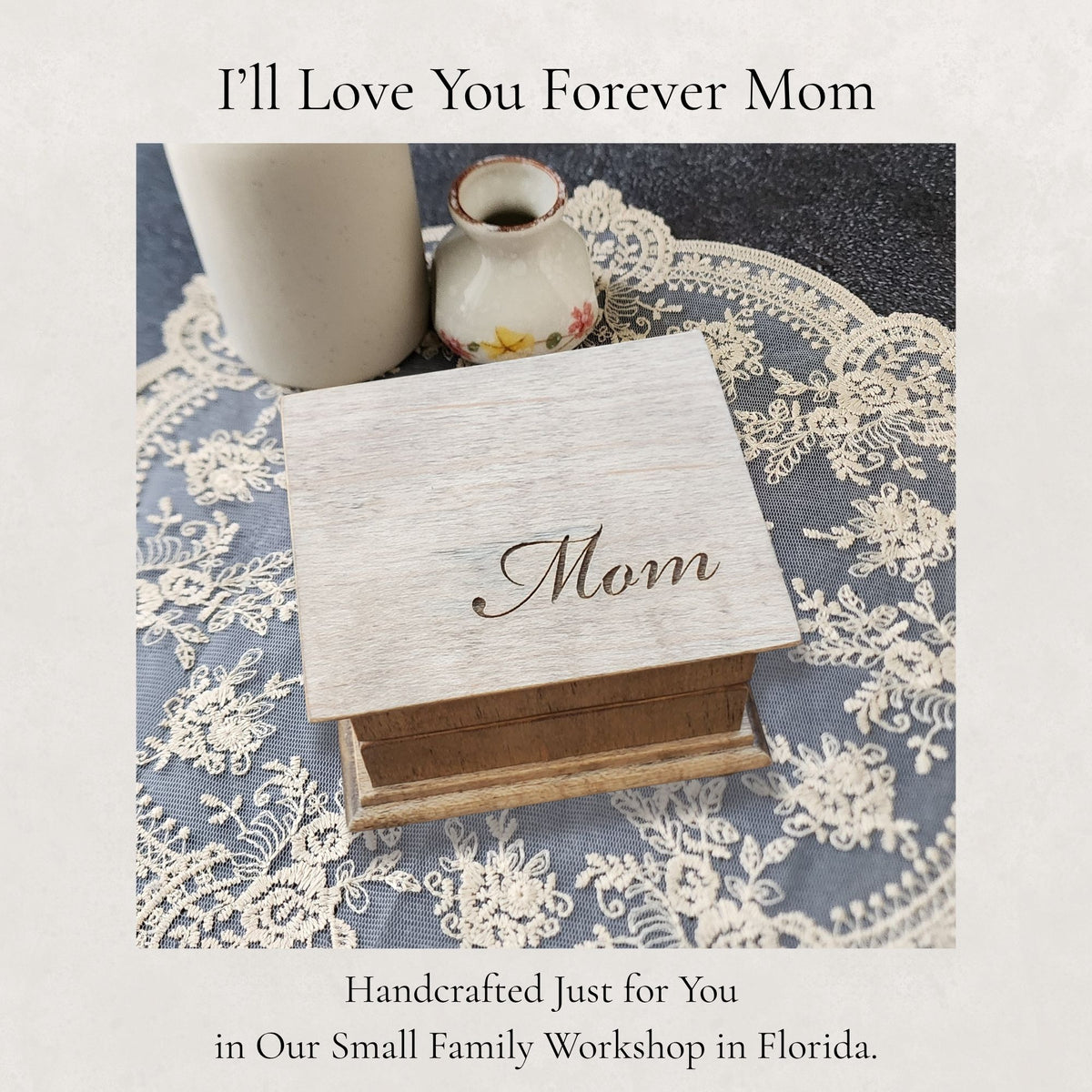 Wooden music box engraved with 'Mom' on a lace tablecloth with text about a family workshop.