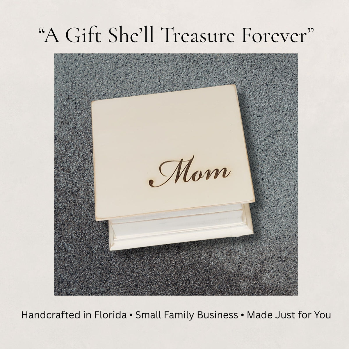 Music Box Gift with 'Mom' engraved on top, placed on a textured surface. Above there is a writing saying "A Gift She'll Treasure Forever." 