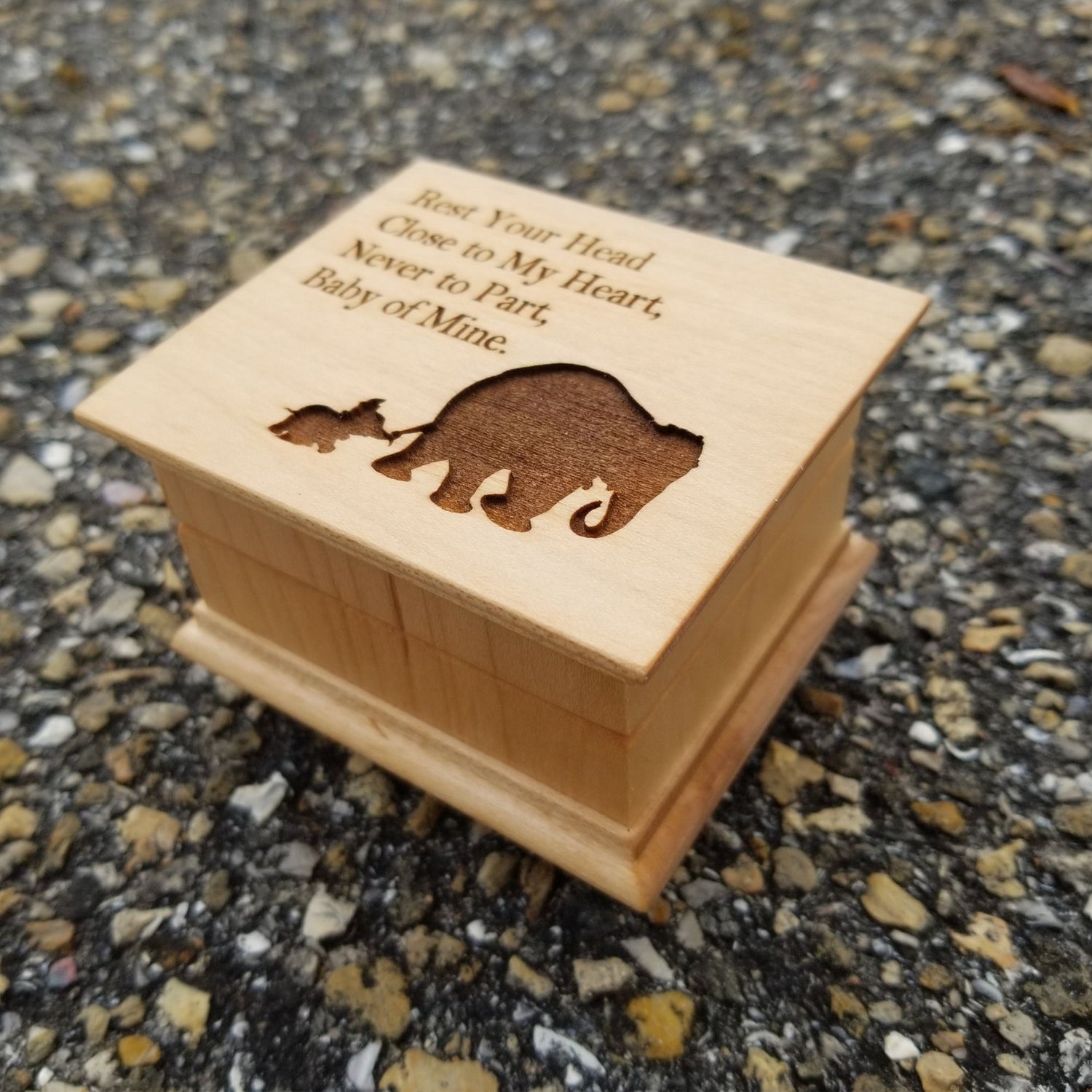 small wooden music box in maple with a momma and baby elephant silhouette engraved on the top along with the quote Rest Your Head Close to My Heart.... , choose the song Baby Mine and create a one-of-a-kind keepsake