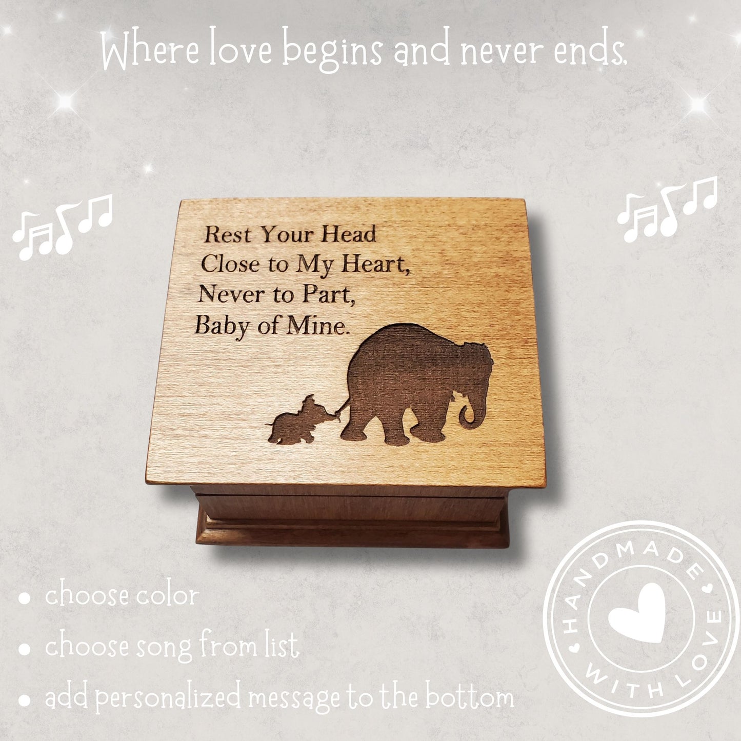 small wooden music box in chestnut with a momma and baby elephant silhouette engraved on the top along with the quote Rest Your Head Close to My Heart.... , choose the song Baby Mine and create a one-of-a-kind keepsake