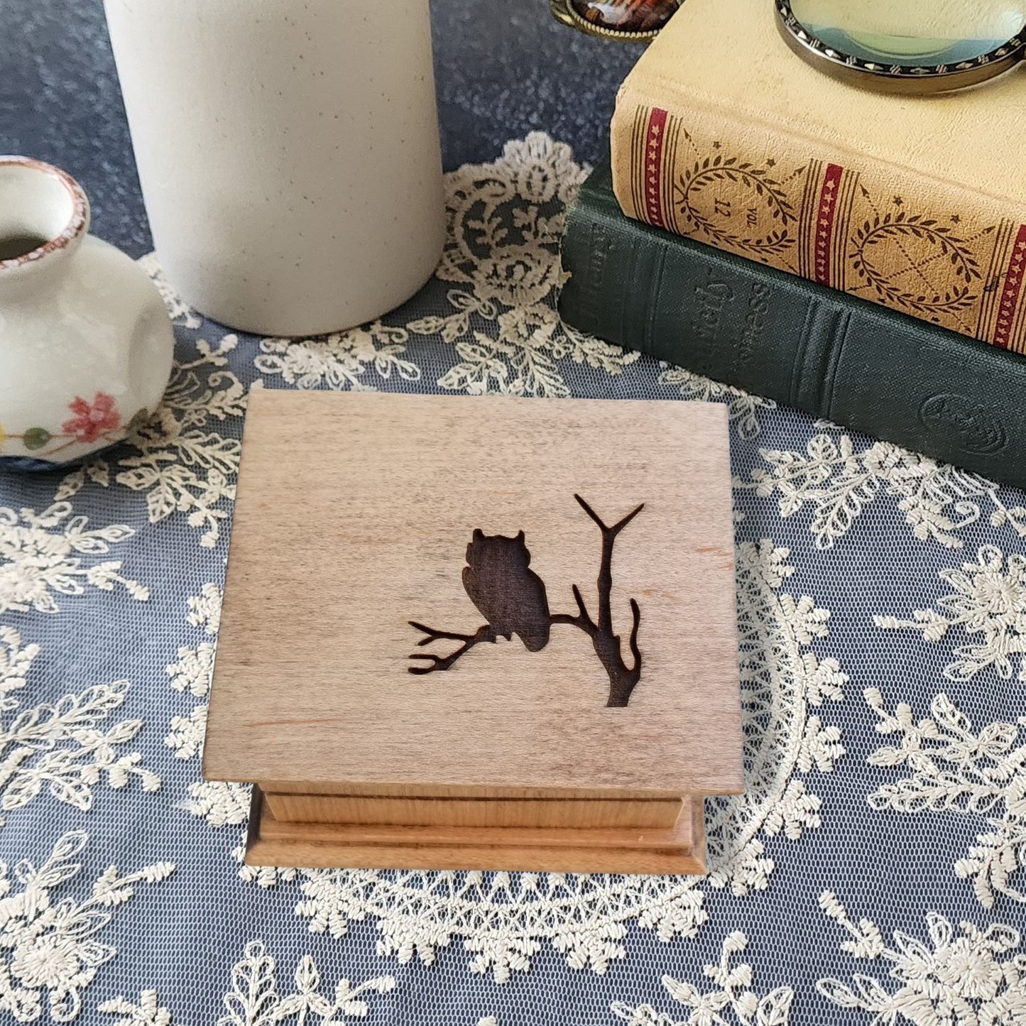 Small wooden wind-up music box with engraved owl sitting on a branch – handmade personalized keepsake gift.