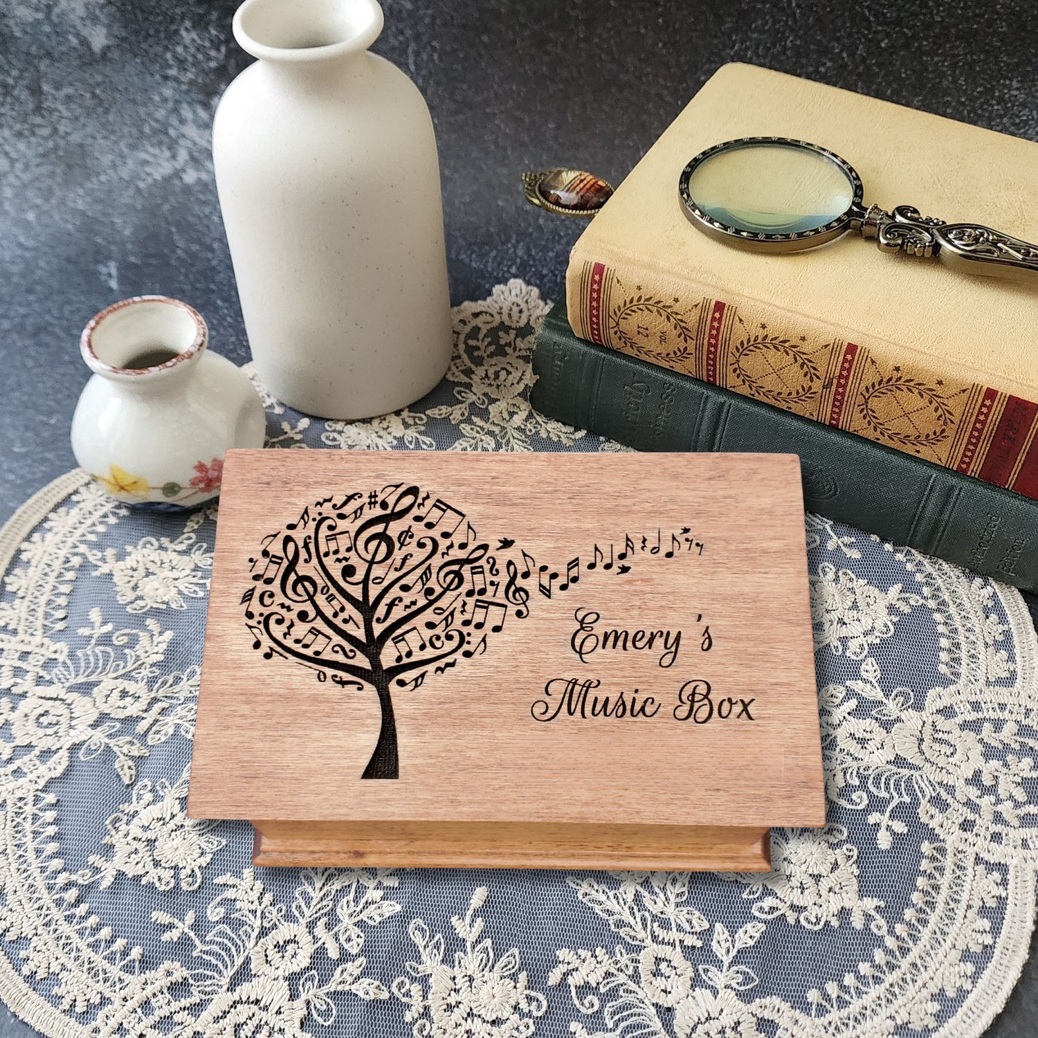 Personalized wooden jewelry box with engraved music tree design and name ‘Emery’s Music Box,’ handcrafted custom song box in natural wood color