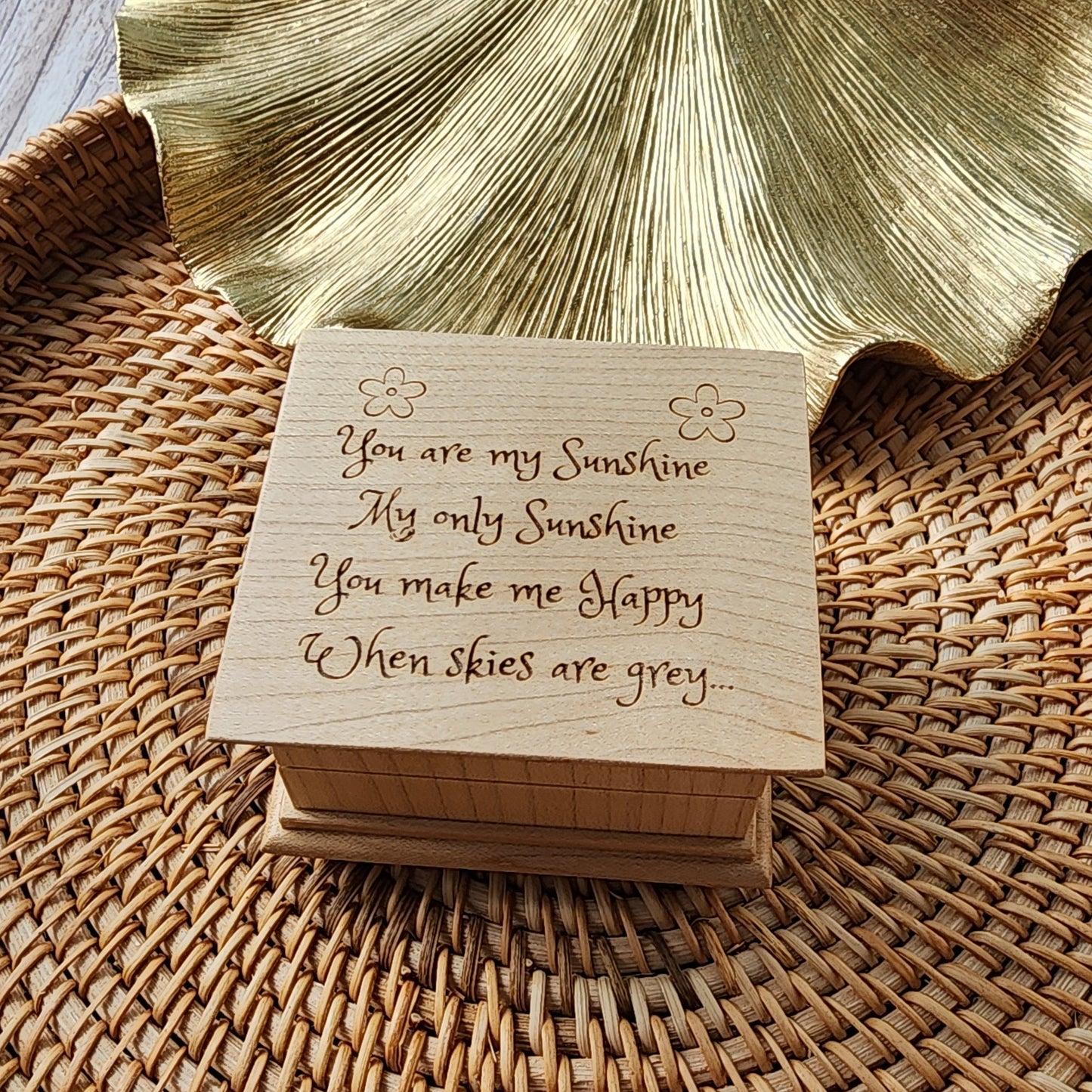 wooden music box with You are my sunshine engraved on the top,