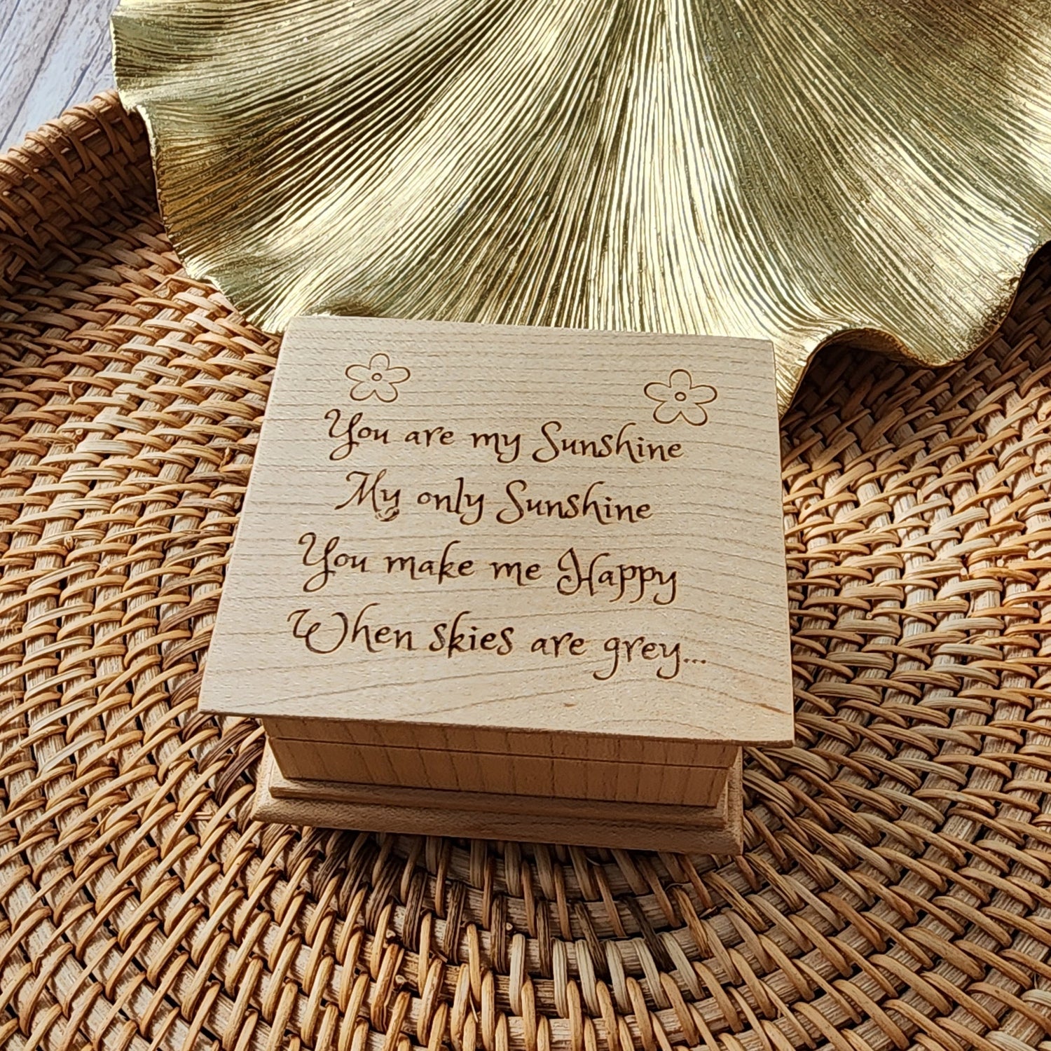 wooden music box with You are my sunshine engraved on the top,