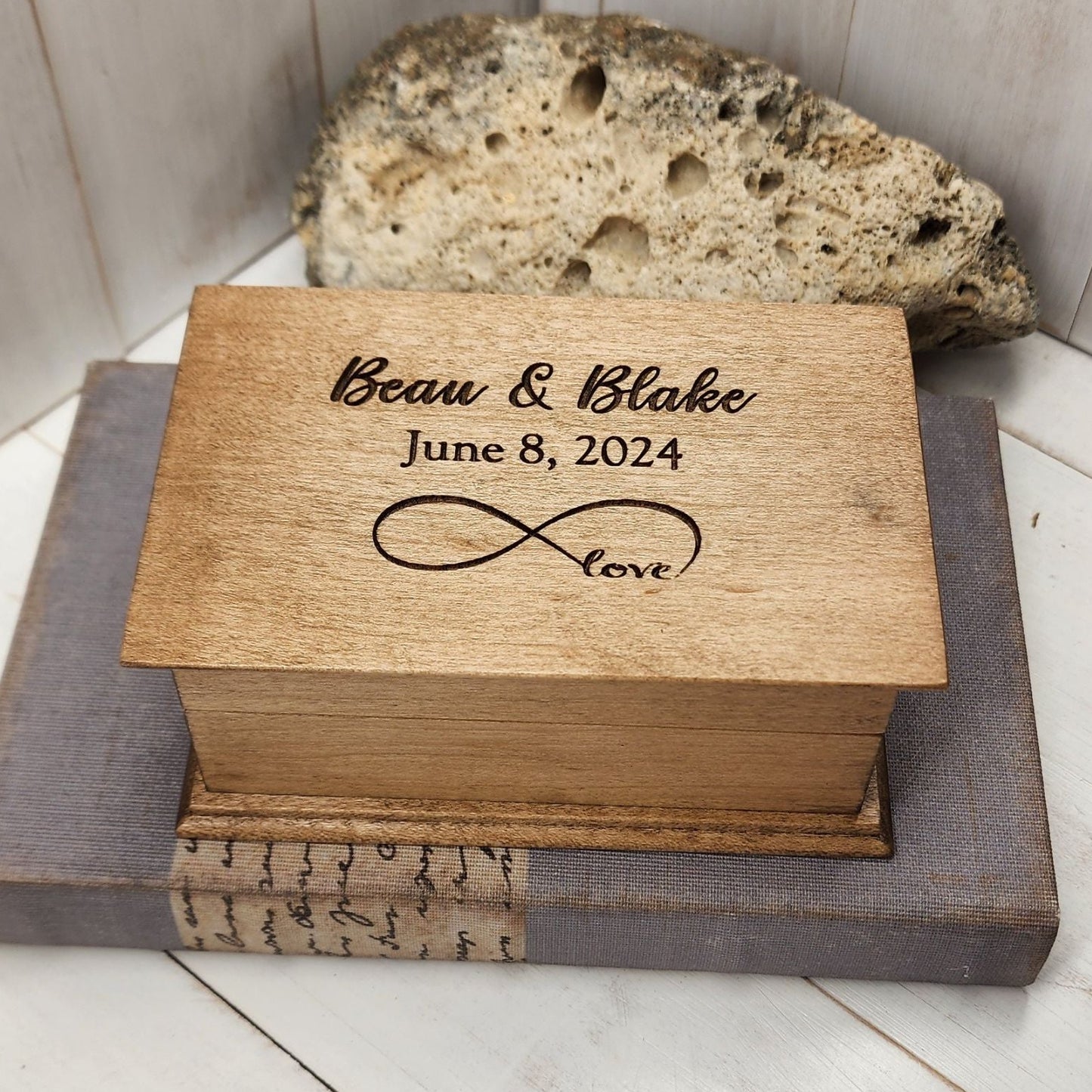 Personalized infinity love music box engraved with names “Beau & Blake,” date “June 8, 2024,” and infinity symbol with word “love.”