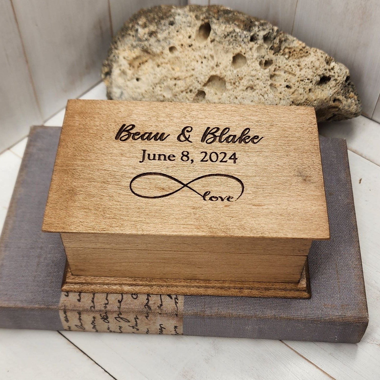 Personalized infinity love music box engraved with names “Beau & Blake,” date “June 8, 2024,” and infinity symbol with word “love.”