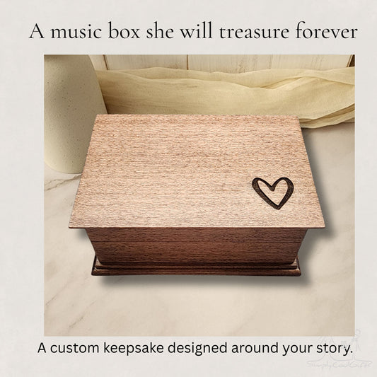 Wooden music box with a heart design on a marble surface, choose any song