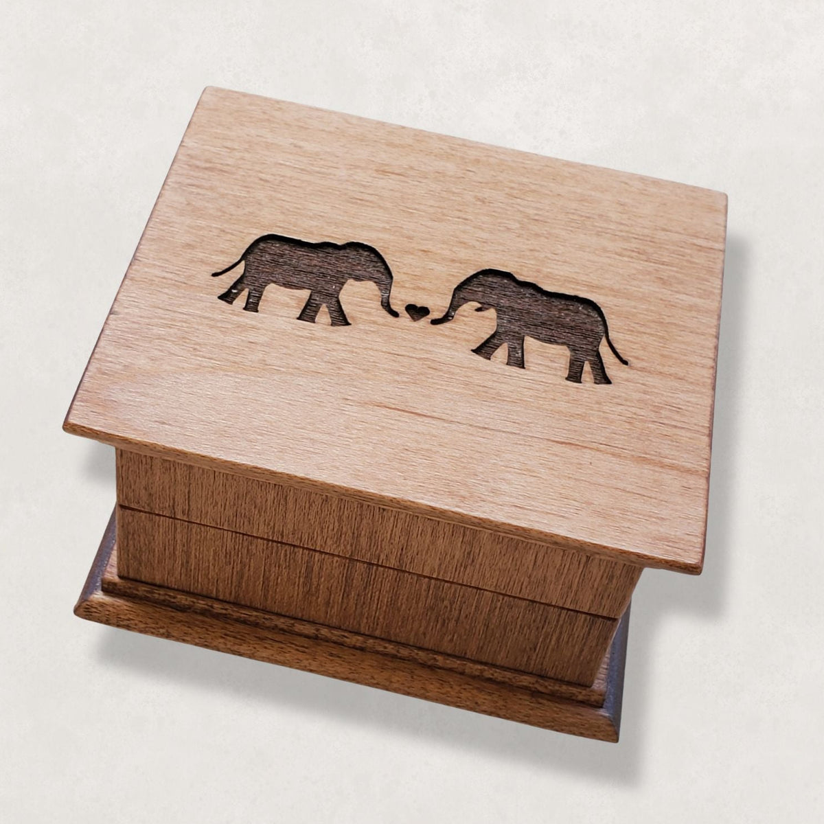 Romantic elephant couples wind up music box engraved with two elephants forming a heart on wooden lid