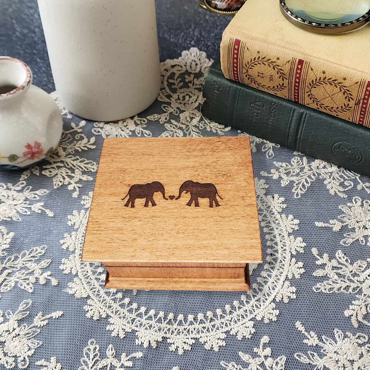 Romantic elephant couples wind up music box engraved with two elephants forming a heart on wooden lid