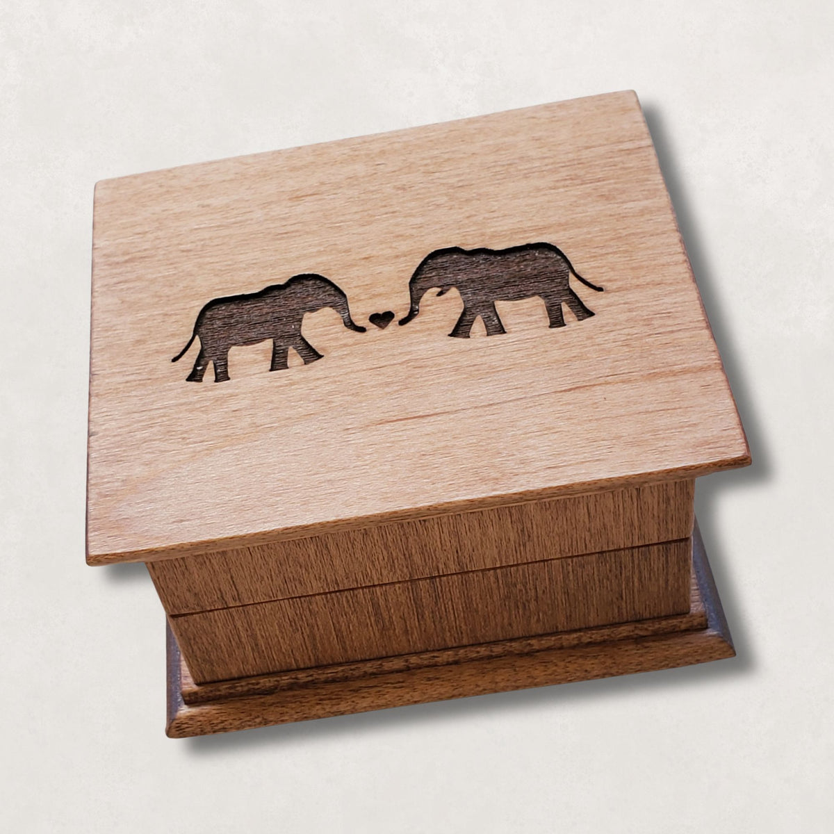 Romantic elephant couples wind up music box engraved with two elephants forming a heart on wooden lid
