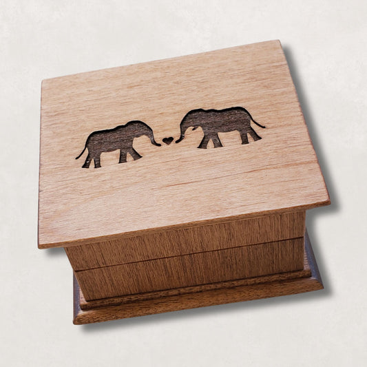 Romantic elephant couples wind up music box engraved with two elephants forming a heart on wooden lid