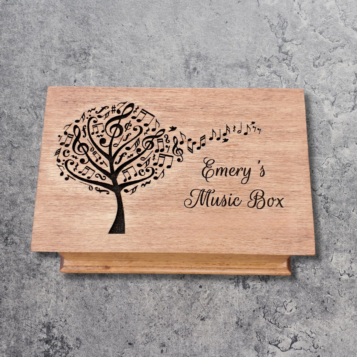Personalized wooden jewelry box with engraved music tree design and name ‘Emery’s Music Box,’ handcrafted custom song box in natural wood color