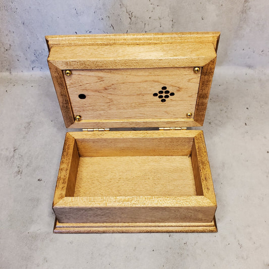 wooden music box with the lid open showing the panel under the lid with the light sensor and the speaker hole. Custom-made music box works with any songs made in the USA.
