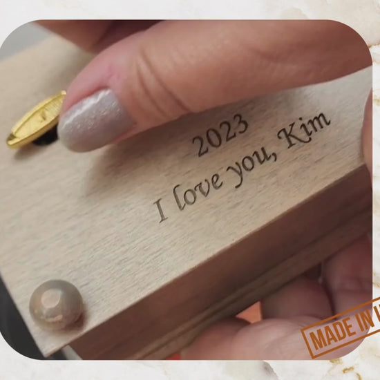 music box video with personalized engraving showing how the wind up music jewelry box work