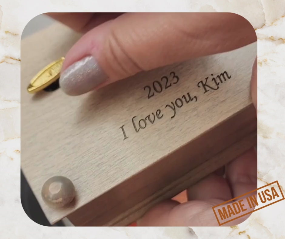 music box video with personalized engraving showing how the wind up music jewelry box work