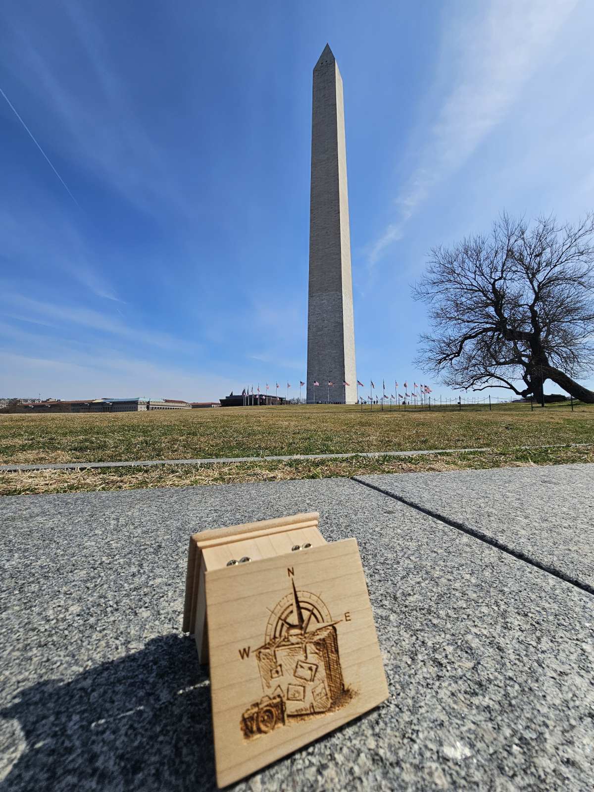The traveling music box with compass design in front of the Washington Monument