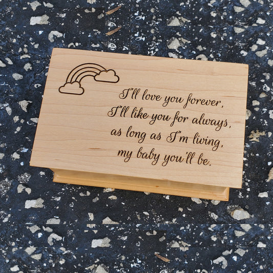 wooden jewelry box with a rainbow design and I'll love you forever engraved on top