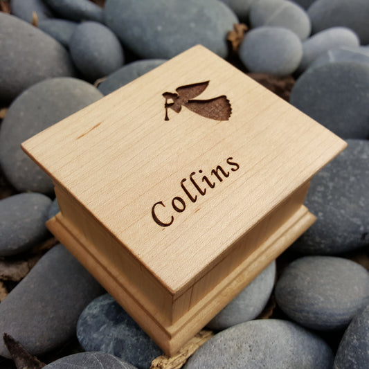 angel music box engraved with your name, choose color and song. Religious music
