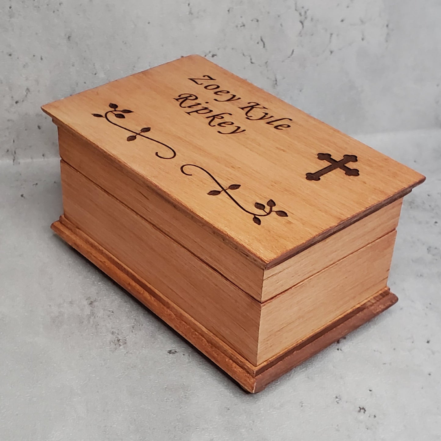 Christening box with name and cross on top with built in music player