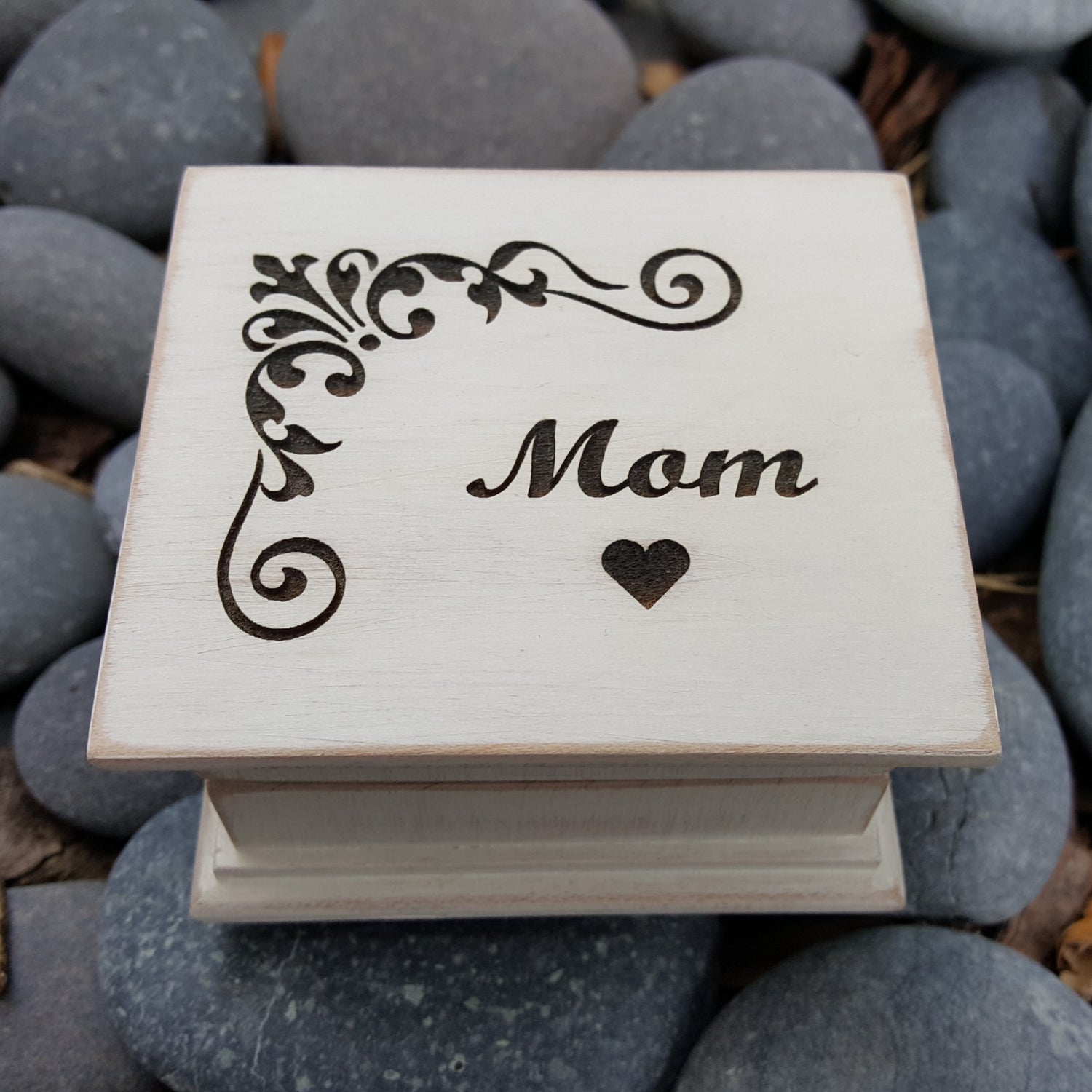 White music box with corner design and Mom with heart engraved on the top