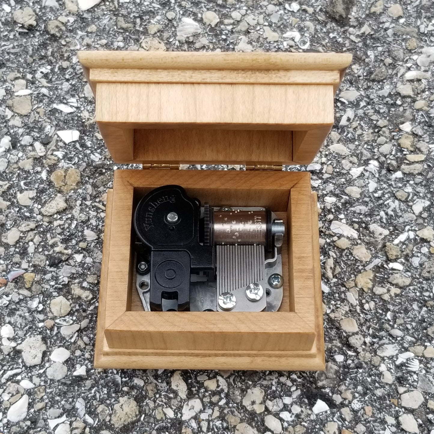 wooden music box with open lid showing music box movement inside, choose your song, color, personalize