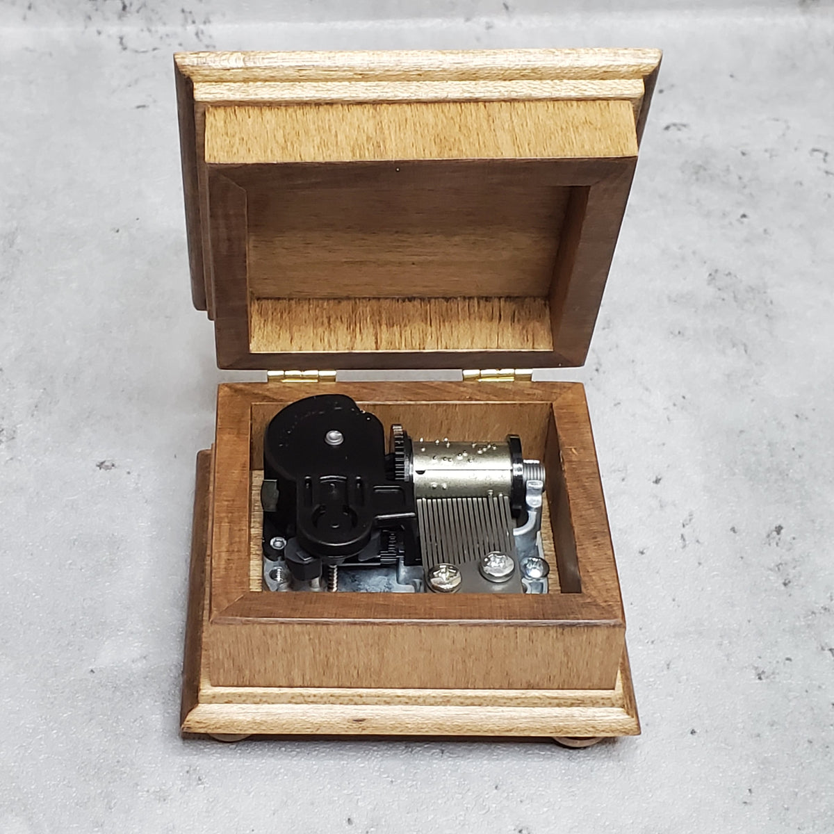 music box with open lid showing 18 note wind up music box movement inside with NO additional space for jewelry, if you'd like a jewelry box, check out the custom song jewelry box section. Handmade in USA, with quality maple wood

