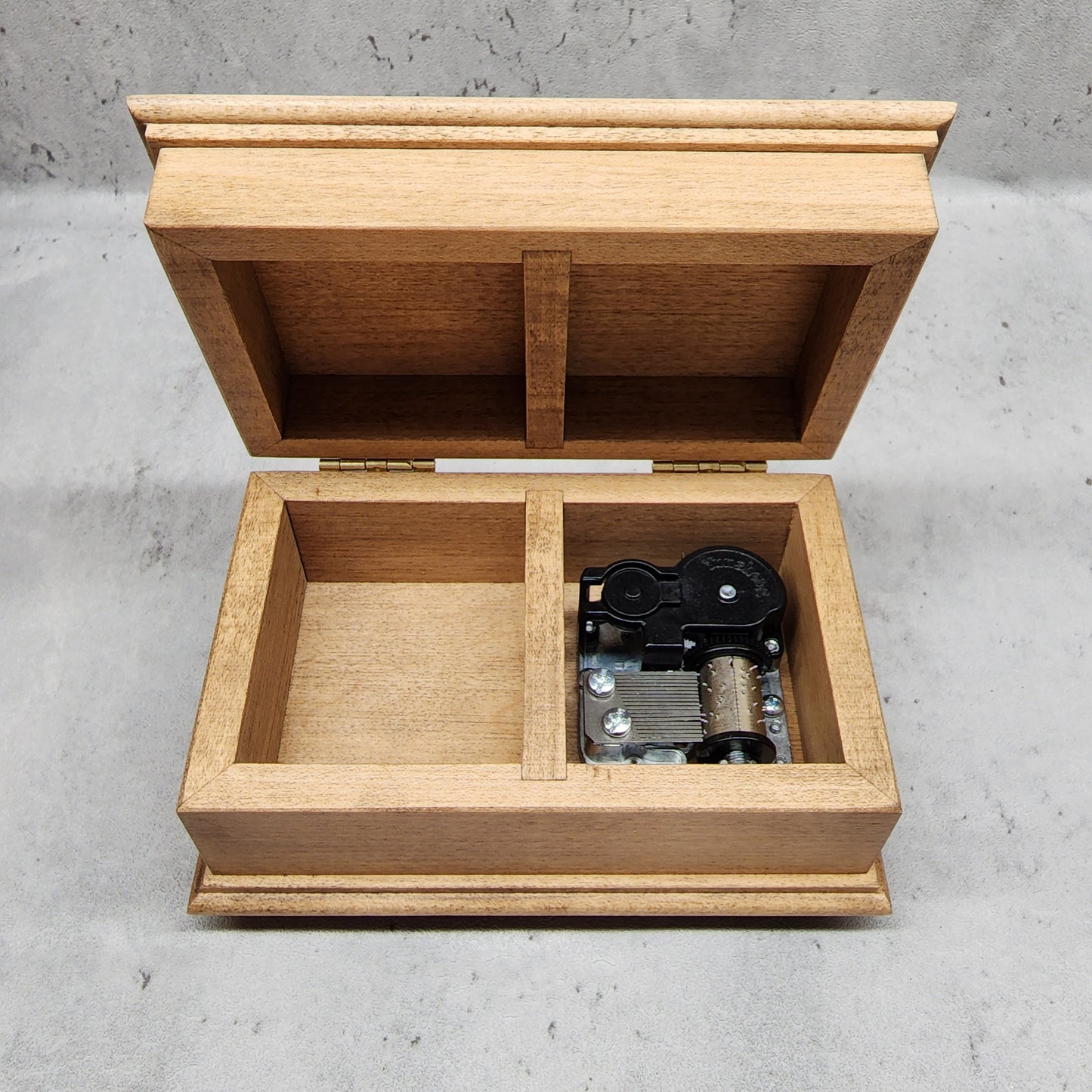 jewelry box with open lid showing music box movement and additional compartment inside, maple of high quality maple wood, choose engravings, color and song