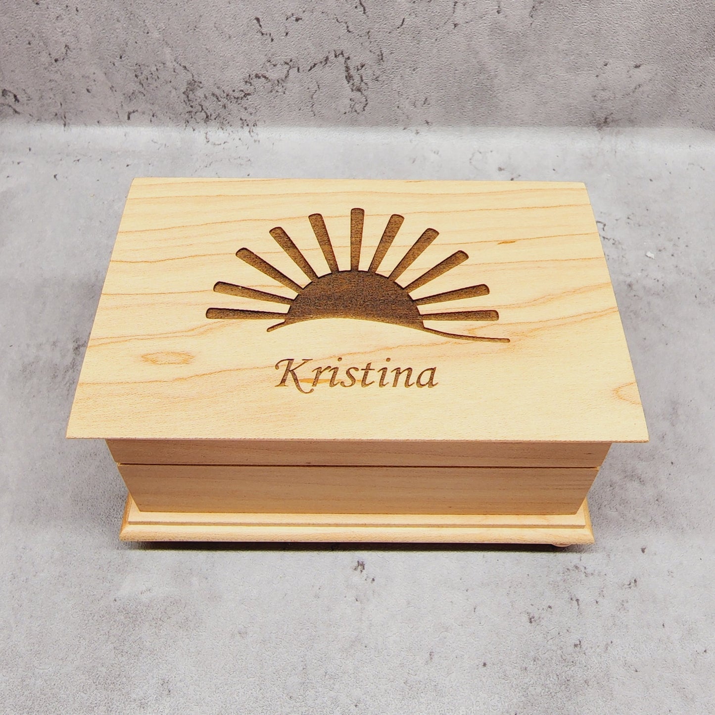 wooden jewelry box with sun and name engraving on top