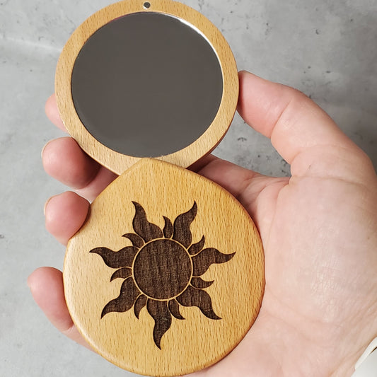 beauty mirror engraved with sun, perfect size to fit into your purse to check your smile